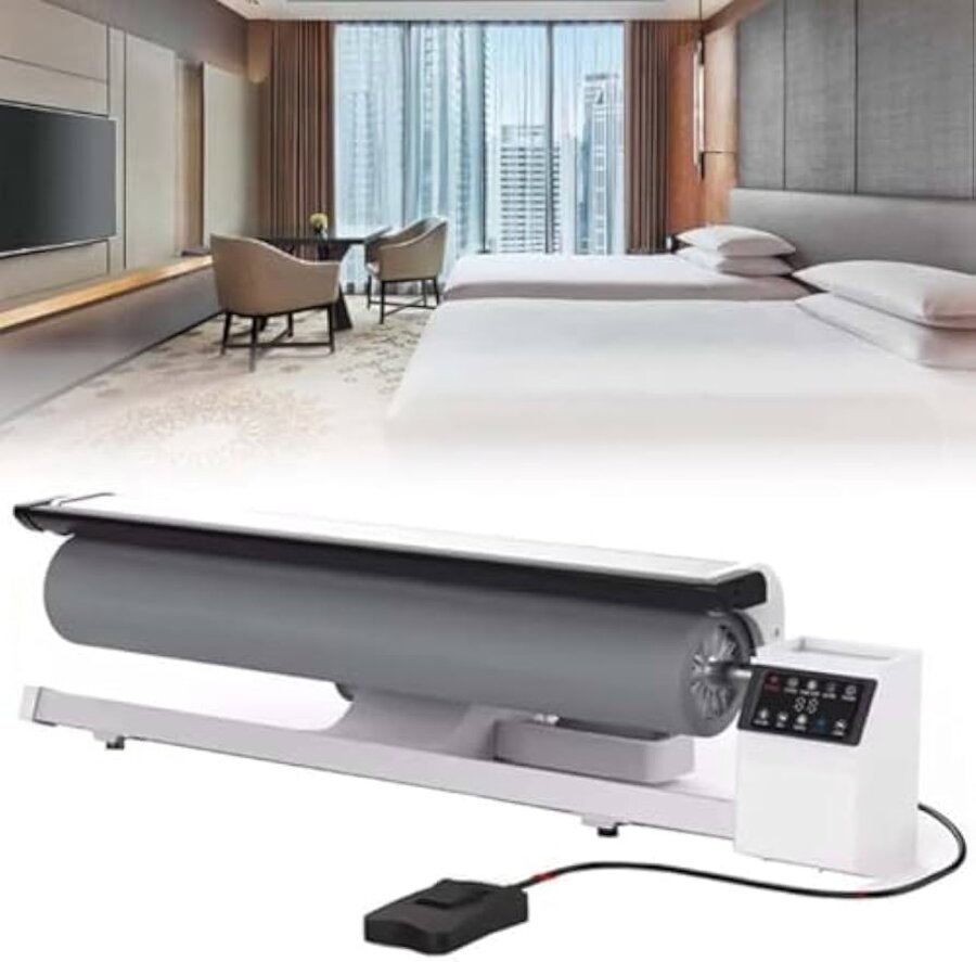 Commercial roller iron pressing bed linen to a hotel-standard finish.